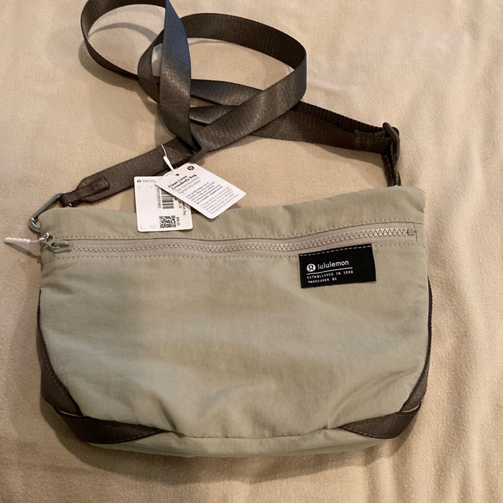 NWT Lululemon Clean Lines Crossbody Bag. 11.8x2x7.9. Volume 2.8L. Color: khaki